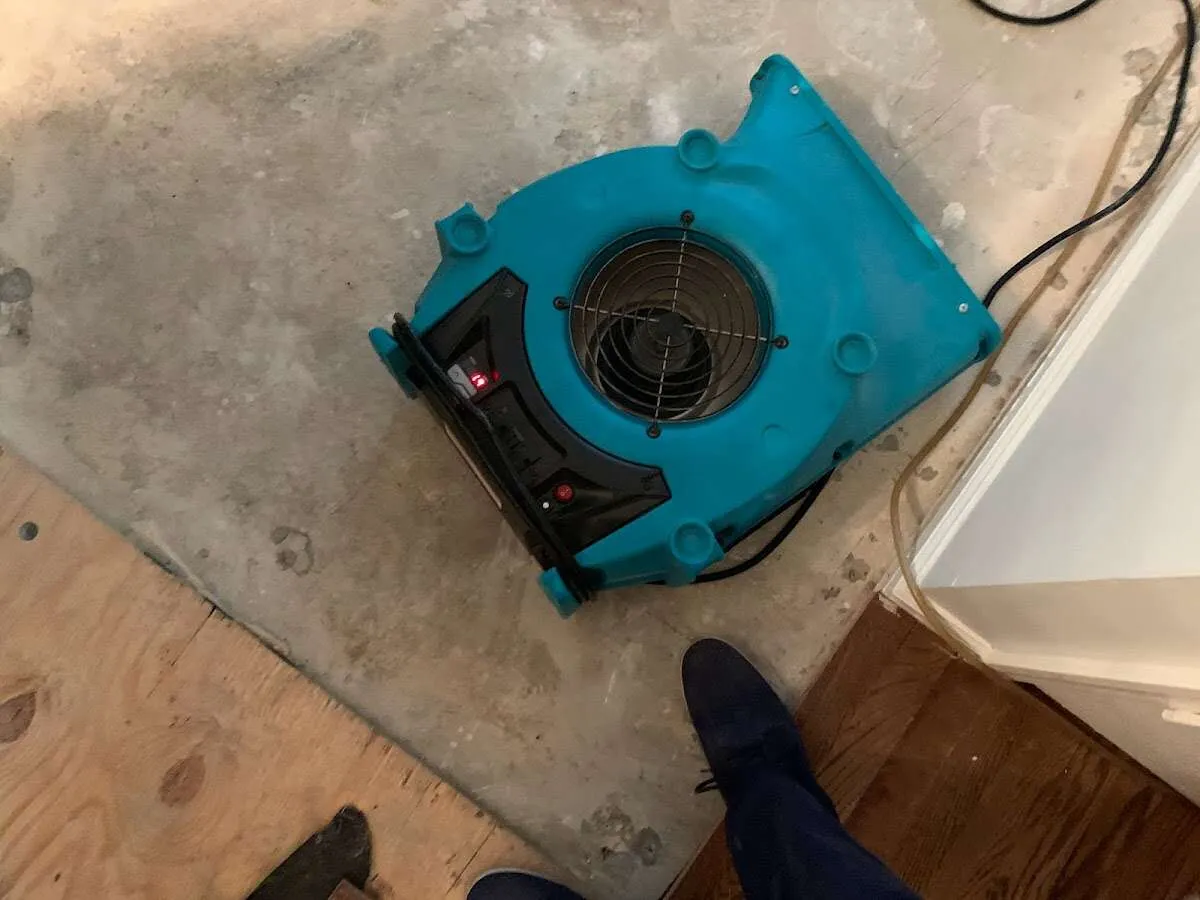 Air mover drying subfloor during Leak Detection & Repair in Ammon